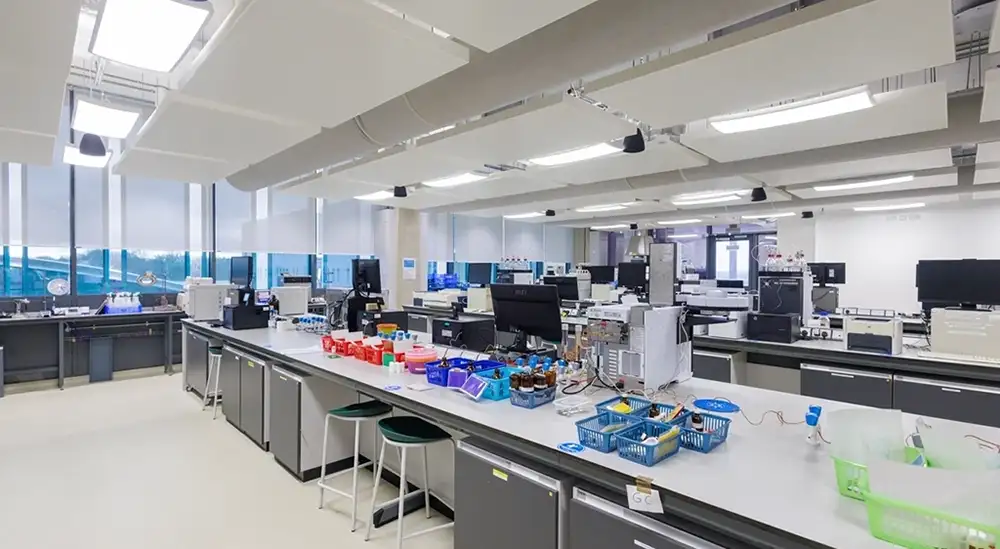 A room with computers on desks and analysis equipment