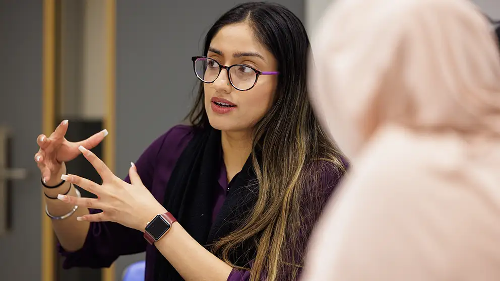 Lecturer talking to a student