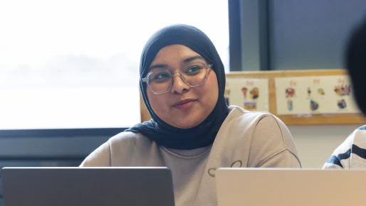 Student in a headscarf smiling
