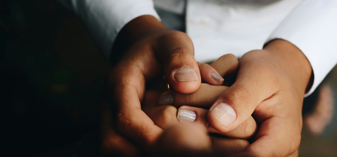 An image showing holding hands