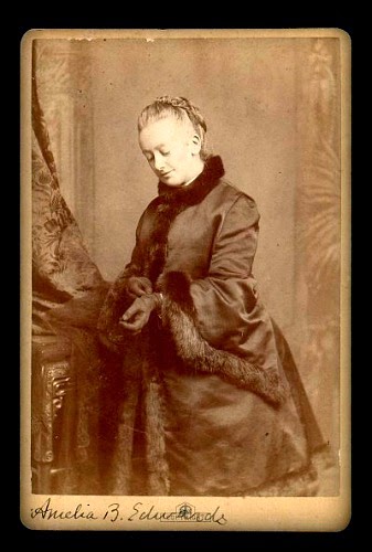 Vintage black and white photo of white woman in Victorian dress