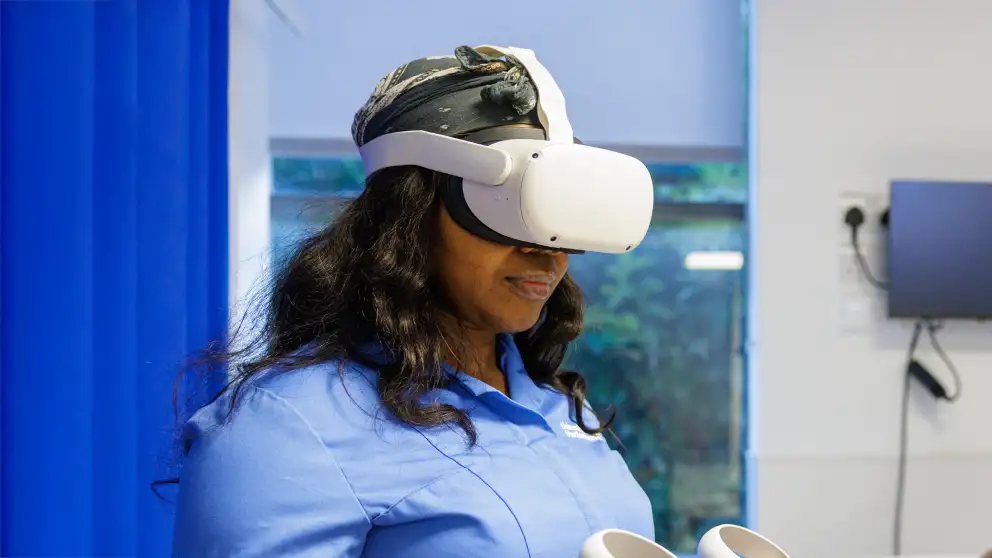 A student nurse wearing a VR headset
