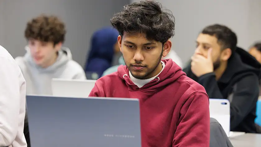 A student working on a laptop