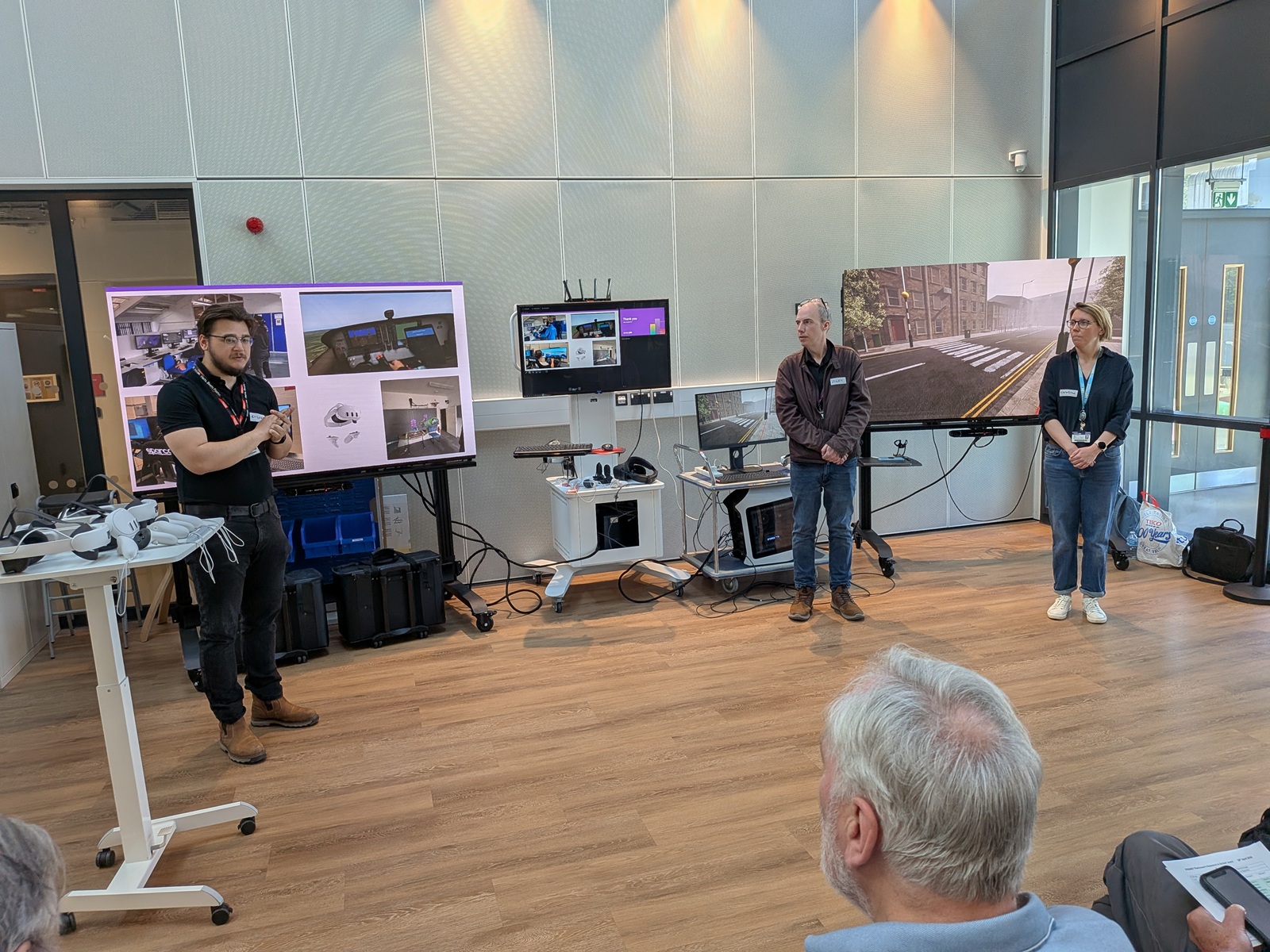 Three people presenting to an audience