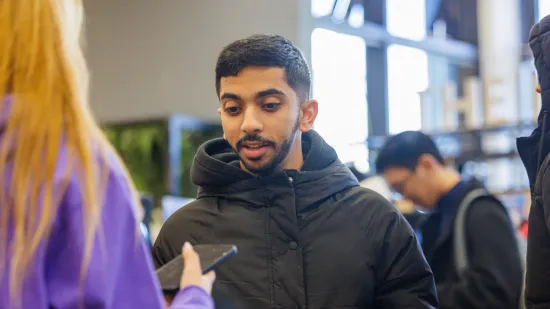 Student smiling and talking