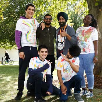 Students outside with paint on their tops