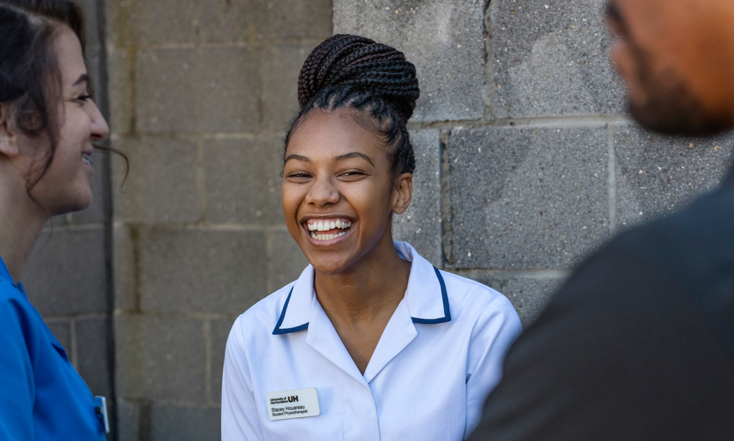 Black student nurse laughing