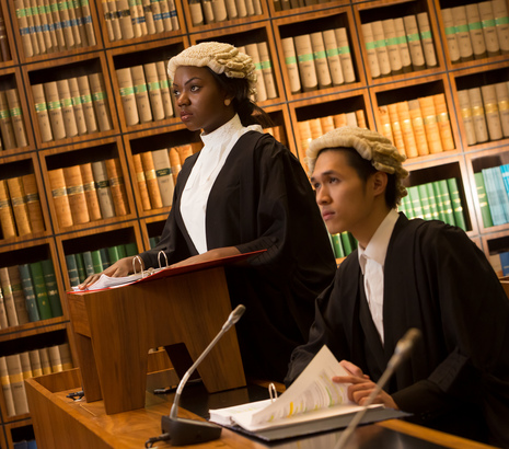 Female and male lawyer in wig and robe