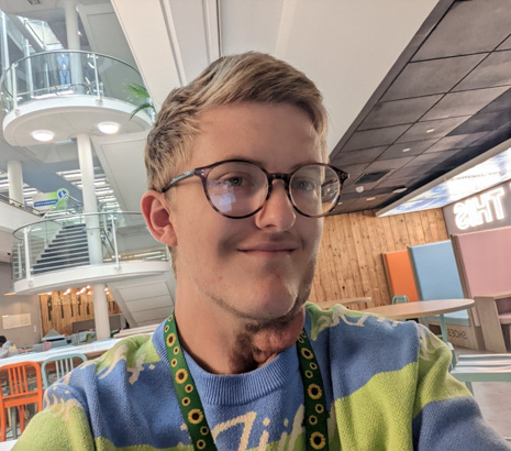 Image of a male student sitting at a desk