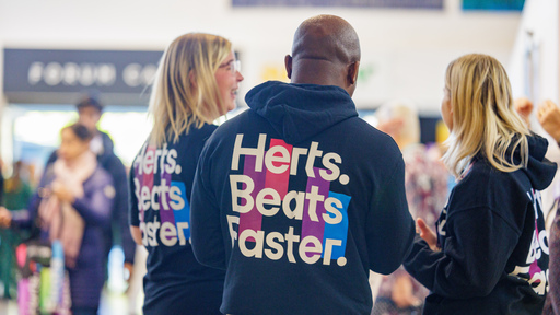 Staff wearing Herts-branded hoodies
