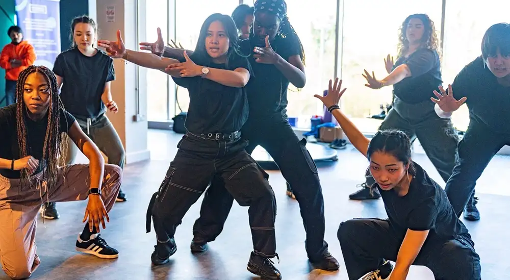 A group of students dancing as part of an event