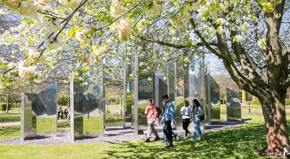 A group of people going on a sculpture walk