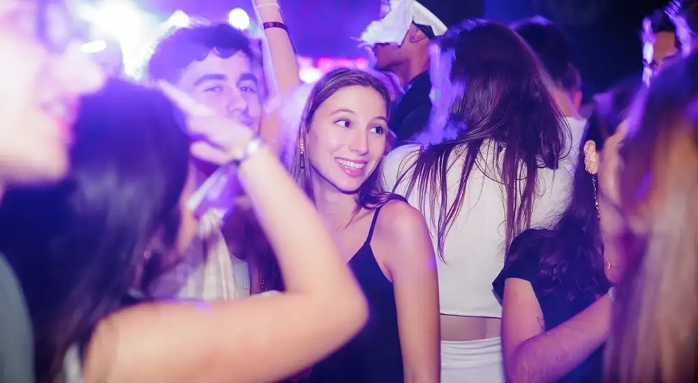 Two students posing for a picture in the University nightclub