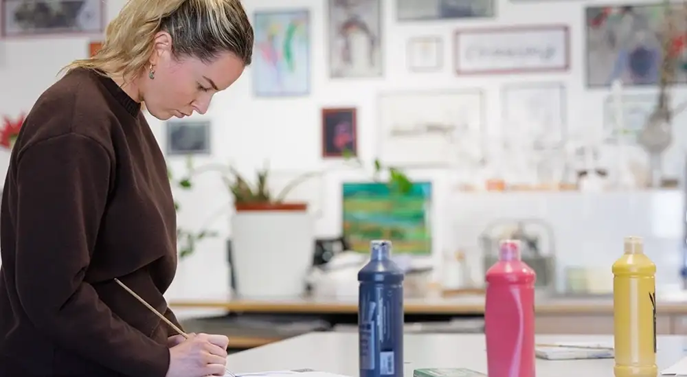 Student doing art work