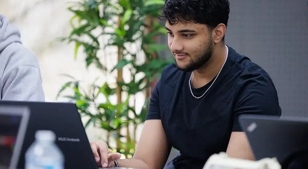 A student working at a laptop
