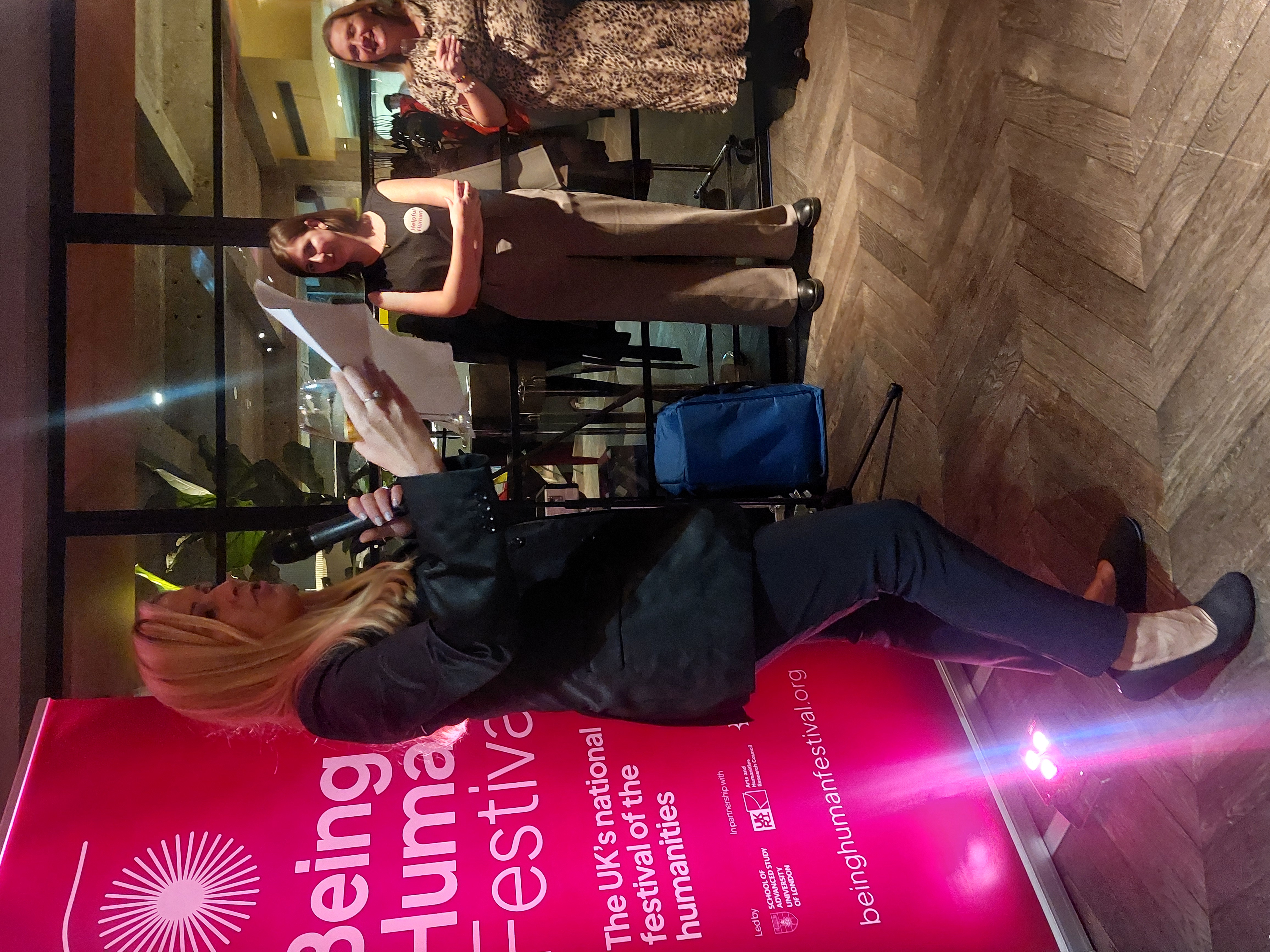 Sarah Churchill talking in front of a banner