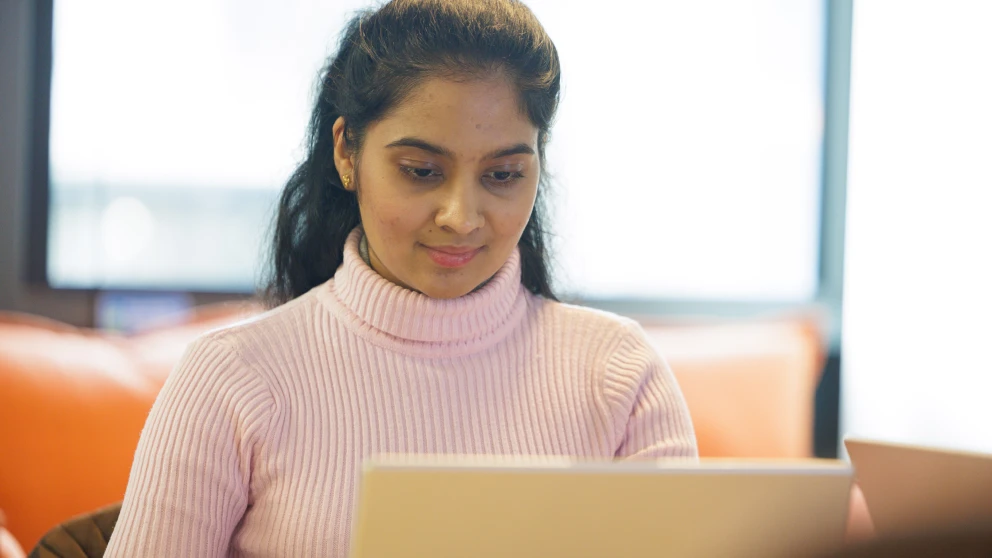 Person looking at laptop 