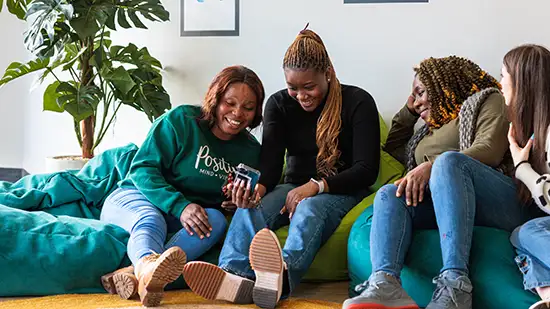 Four people sitting in social space 
