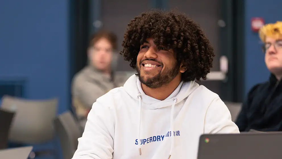 Student smiling in a lecture
