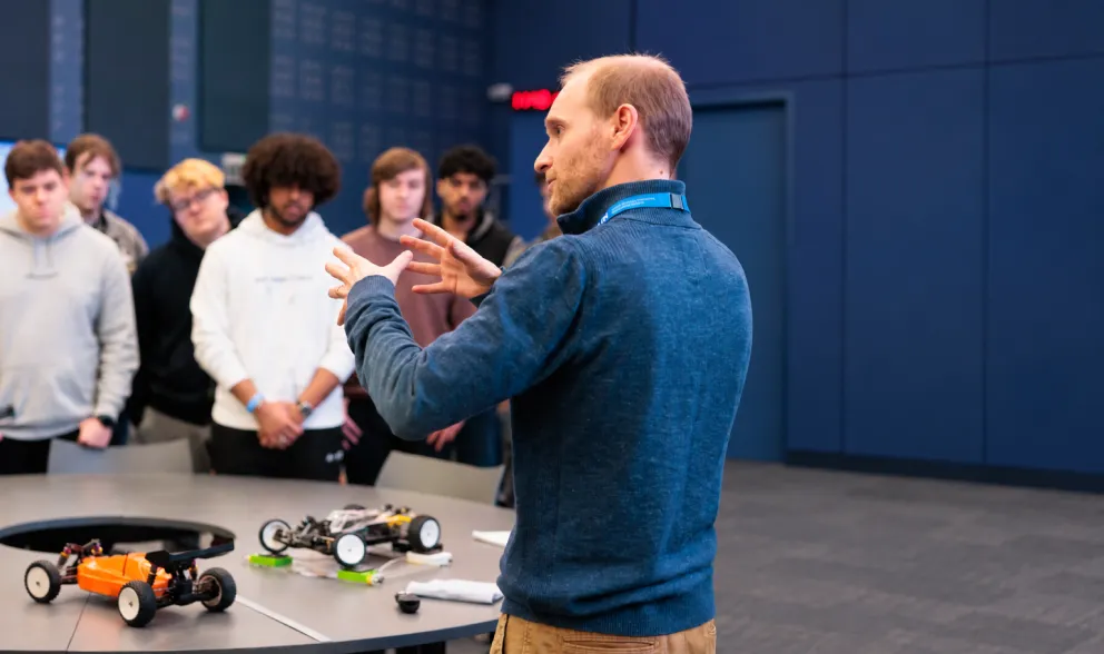 Lecturer talking to a room of students in spectra