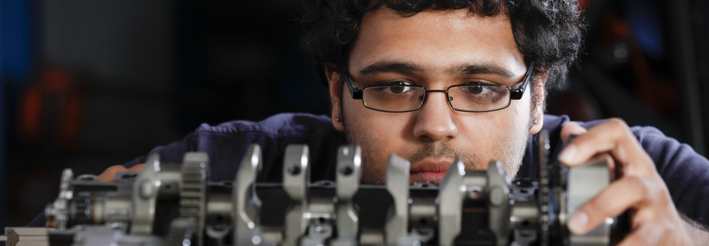 Male student working on robotics