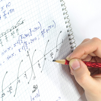 Student writing equations