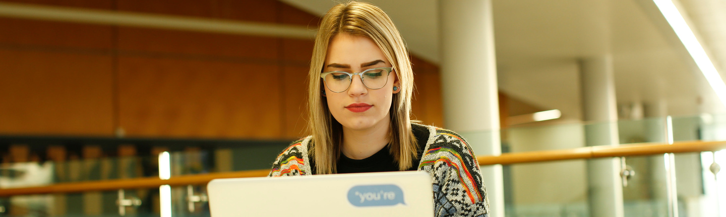 Female student using a laptop