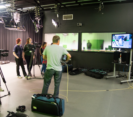 Students working in film production studio