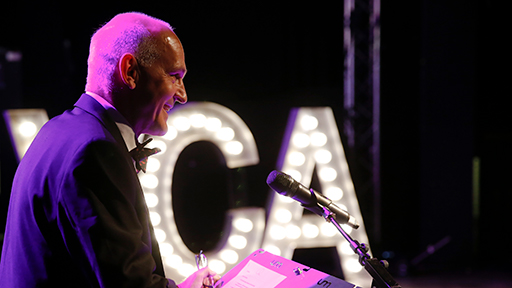 Vice Chancellor, Quintin McKellar smiles as he delivers a speech at a podium