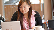 Girl at home on computer studying
