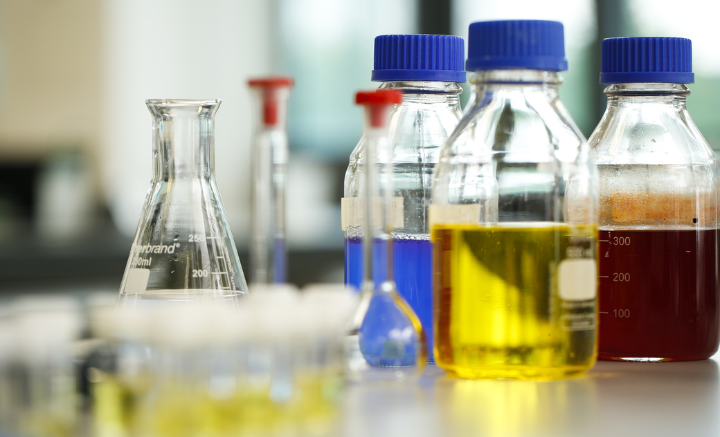 a variety of flasks and bottles with chemicals in them