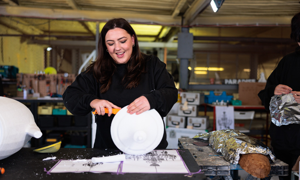 Grace working on a sculpture in the workshop