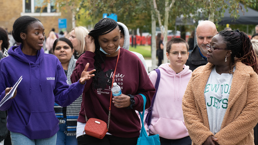 Image of a group of people touring  campus
