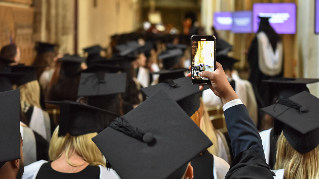 Graduate with a phone