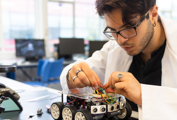 Male student working on a project