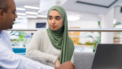 Student talking with an advisor. 