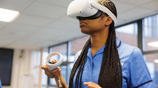 A young female black nursing student wearing a VR headset
