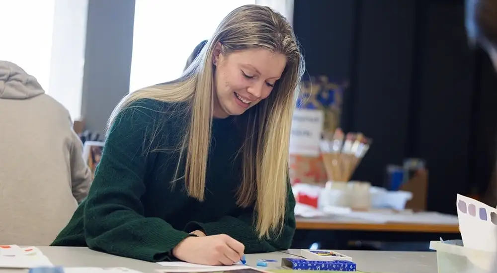 Student doing art work