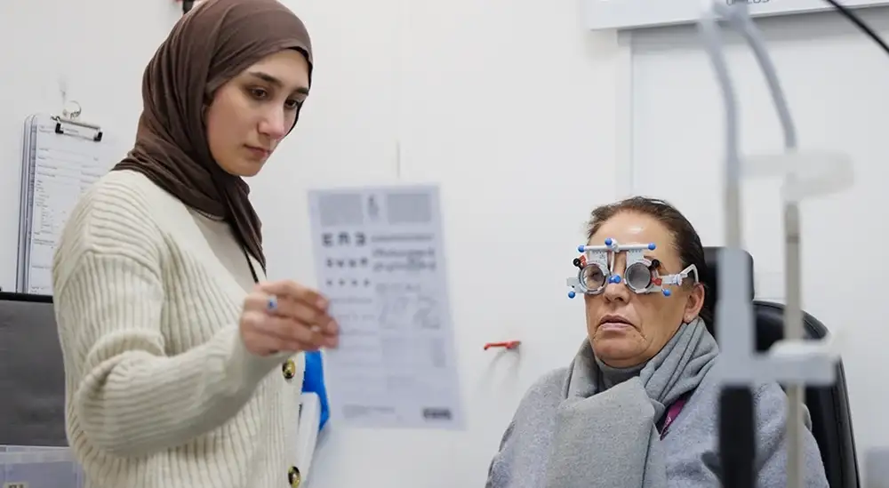 A student practicing an eye exam