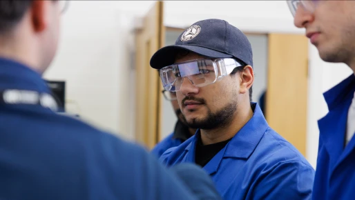 A student wearing safety goggles