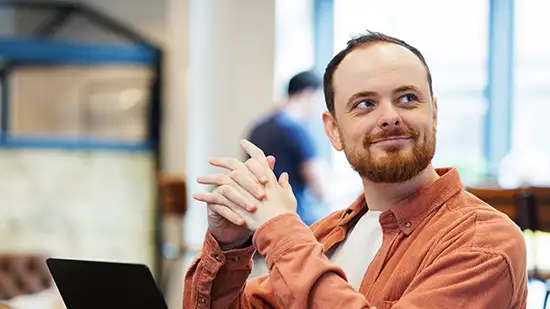 Person smiling while sitting
