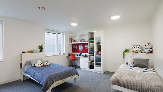 two bed and desks 