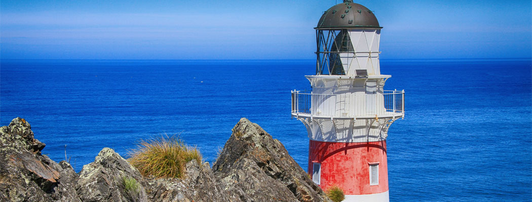 Lighthouse next to sea