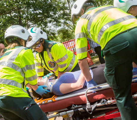 Paramedics looking after patient at car crash