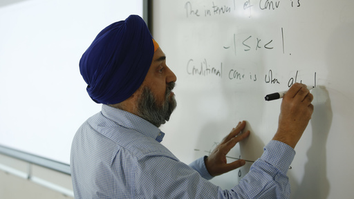 Man writing on board