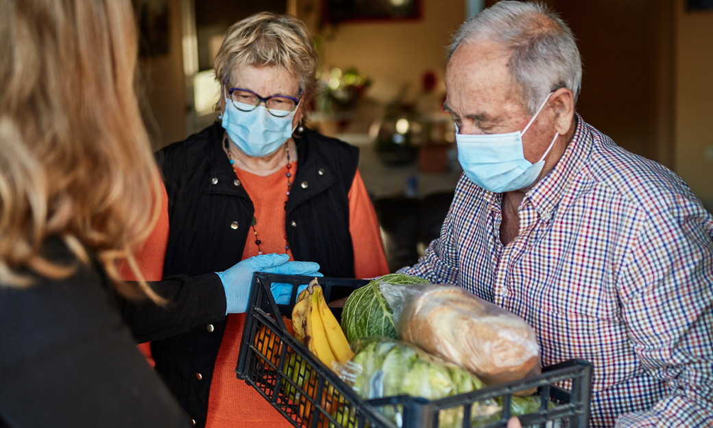 Older adult receiving a food parcel during the pandemic