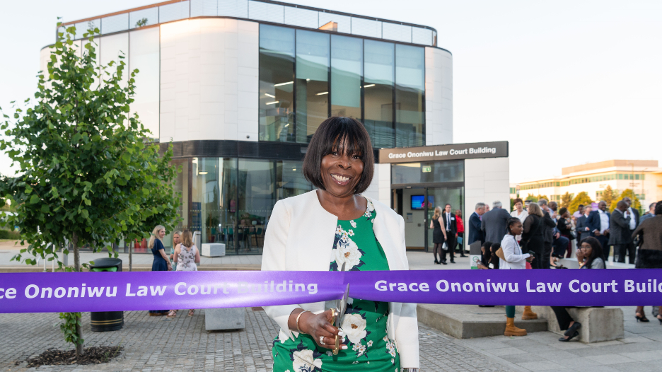 Grace Ononiwu cutting the ribbon to reveal the Law Court building