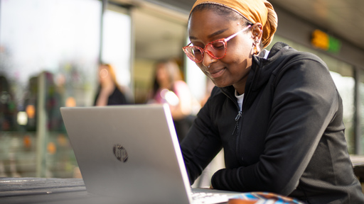 A student watching a video on her laptop