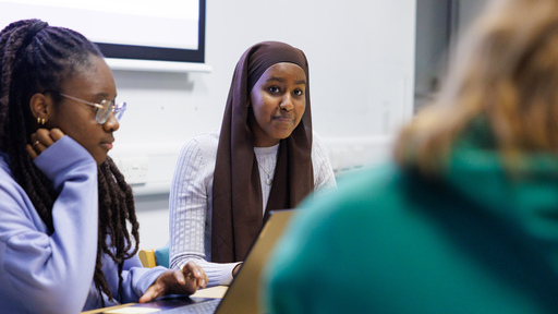 Three students talking