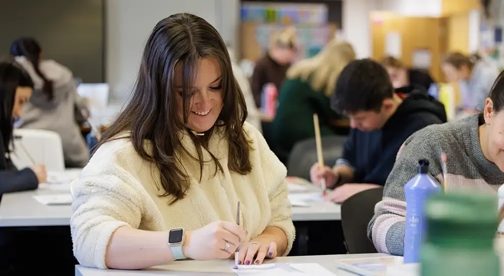 Student doing art work